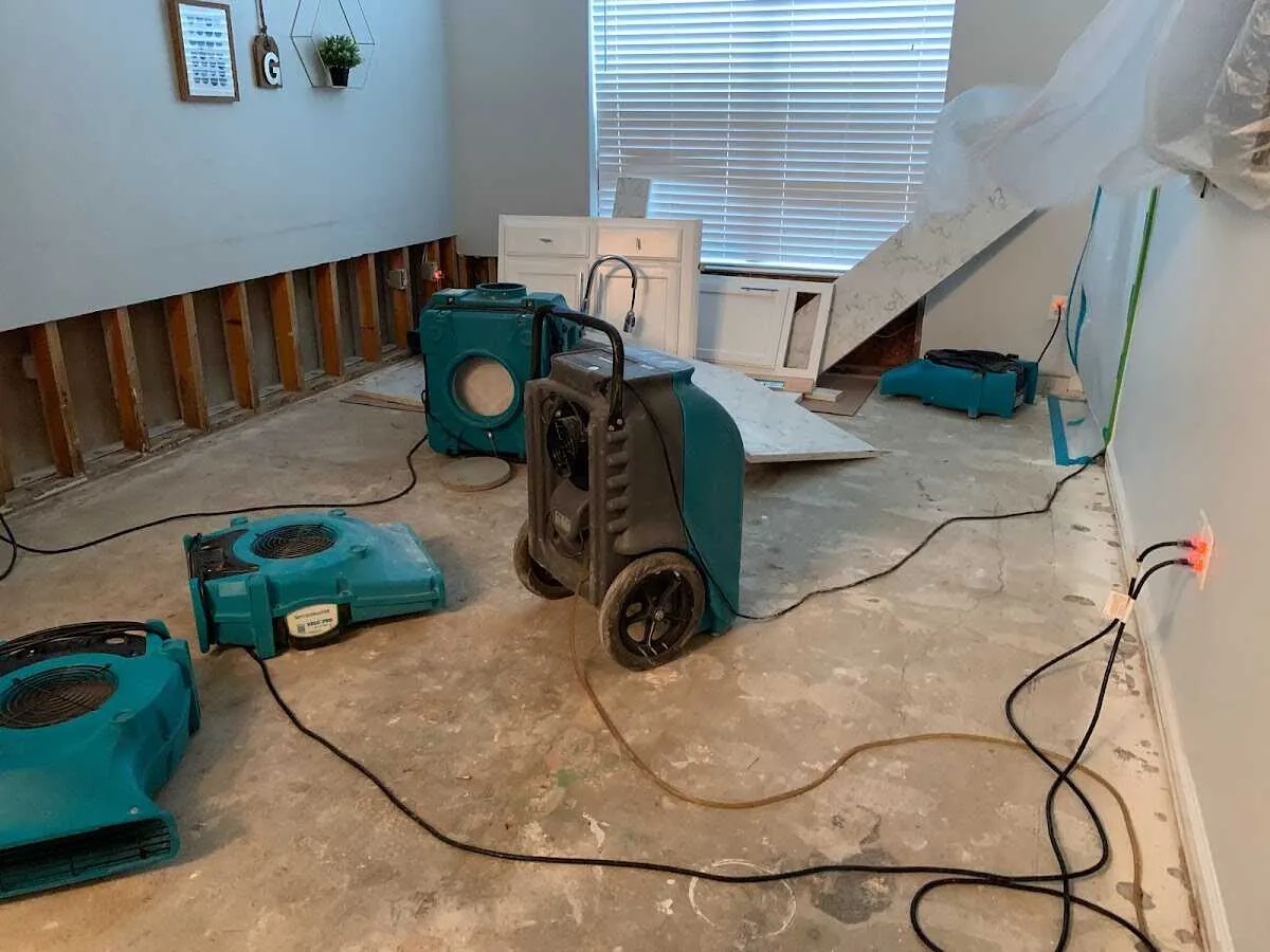 Dehumidifier in flood-cut room for Water Damage Restoration in Little Canada